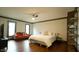 Bright and spacious bedroom with a queen bed, sitting area and ceiling fan at 917 Queensferry Rd, Cary, NC 27511