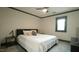 Cozy bedroom with neutral walls, dark trim, a ceiling fan, and a comfortable bed at 917 Queensferry Rd, Cary, NC 27511