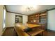 Elegant dining room with wooden floors, a large wooden table, and custom built-in shelving at 917 Queensferry Rd, Cary, NC 27511