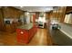 Spacious eat-in kitchen boasts modern cabinets, stone counter tops, stainless steel appliances, and wood floors at 917 Queensferry Rd, Cary, NC 27511