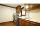 Laundry room with front load washer/dryer, sink, and window at 917 Queensferry Rd, Cary, NC 27511