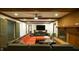 Spacious living room with a large fireplace, wooden beams and an entertainment center at 917 Queensferry Rd, Cary, NC 27511