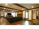 Inviting living room with a brick fireplace, dark sofa, and wooden beam accents at 917 Queensferry Rd, Cary, NC 27511