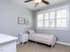 Cozy bedroom with neutral walls, white shutters, and a ceiling fan at 921 Marshall Farm St, Wake Forest, NC 27587