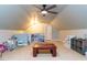 Second view of spacious bonus room featuring open space and finished attic with ample natural lighting at 921 Marshall Farm St, Wake Forest, NC 27587