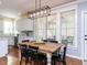 Dining area showcases hardwood floors, window views, and modern pendant lighting at 921 Marshall Farm St, Wake Forest, NC 27587