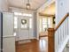 Bright foyer with hardwood floors, white trim, and a view into the adjacent living spaces at 921 Marshall Farm St, Wake Forest, NC 27587