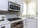 Updated kitchen features stainless steel appliances, gas cooktop, and quartz countertops at 921 Marshall Farm St, Wake Forest, NC 27587