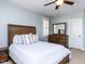 Spacious main bedroom offers a ceiling fan, wood furniture, and plenty of natural light at 921 Marshall Farm St, Wake Forest, NC 27587