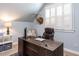Office space with natural light, featuring a stately wood desk, plush leather chair, and deer head mount at 921 Marshall Farm St, Wake Forest, NC 27587