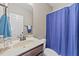 Bathroom features a large mirror, single vanity, and toilet with privacy curtain at 97 Silver Creek Dr, Clayton, NC 27520