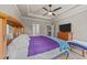 Inviting bedroom with a tray ceiling, neutral walls, and a ceiling fan, and comfortable furnishings at 97 Silver Creek Dr, Clayton, NC 27520