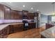 Well-equipped kitchen with dark wood cabinets, stainless steel appliances, and granite countertops at 97 Silver Creek Dr, Clayton, NC 27520