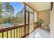 The screened patio overlooks a pool, a manicured yard, and several tall trees at 97 Silver Creek Dr, Clayton, NC 27520