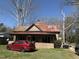 Charming home with a red metal roof and a classic front porch at 1005 Chatham St, Sanford, NC 27330