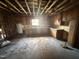 Kitchen under renovation with wood cabinets and window over the sink at 1005 Chatham St, Sanford, NC 27330