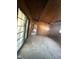 Living room under renovation with wood walls and ceiling at 1005 Chatham St, Sanford, NC 27330