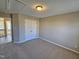 Bedroom featuring neutral paint, carpet and a closet with classic double doors at 1036 Steelhorse Dr, Fuquay Varina, NC 27526