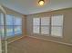 Bedroom with carpet and three large windows to let in the light with white blinds at 1036 Steelhorse Dr, Fuquay Varina, NC 27526