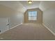 Bedroom with carpet, a window, neutral walls, and a closet at 1036 Steelhorse Dr, Fuquay Varina, NC 27526