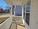 Cozy front porch with white railings, providing a welcoming entrance to the home at 1036 Steelhorse Dr, Fuquay Varina, NC 27526