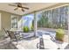 Covered back patio with ceiling fan and outdoor furniture, perfect for enjoying the outdoors year-round at 1038 Branwell Dr, Durham, NC 27703