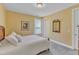 Comfortable bedroom with neutral carpet, natural light, and a cozy atmosphere at 1038 Branwell Dr, Durham, NC 27703