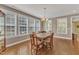 Dining room featuring hardwood floors, lots of natural light and traditional wood table at 1038 Branwell Dr, Durham, NC 27703