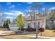 Lovely single-story home offering an attached two-car garage, mature trees, and manicured shrubs at 1038 Branwell Dr, Durham, NC 27703