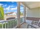 Inviting covered front porch showcasing white railings, supportive pillars, and a comfortable seating arrangement at 1038 Branwell Dr, Durham, NC 27703