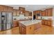Gourmet kitchen features granite counters, custom cabinets, stainless appliances, and center island at 1038 Branwell Dr, Durham, NC 27703