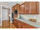 Kitchen features granite counters, wood cabinets, and modern stainless-steel microwave and oven appliances at 1038 Branwell Dr, Durham, NC 27703