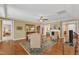 Spacious living room features hardwood floors, elegant furnishings, and access to other living areas at 1038 Branwell Dr, Durham, NC 27703