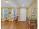 Bright living room with hardwood floors, decorative ceiling, and an abundance of natural light at 1038 Branwell Dr, Durham, NC 27703
