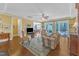 Bright living room with hardwood floors, ceiling fan, and seamless access to outdoor patio and dining area at 1038 Branwell Dr, Durham, NC 27703