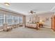 Spacious main bedroom featuring trey ceiling, sitting area, four-poster bed and great natural light at 1038 Branwell Dr, Durham, NC 27703