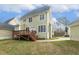 Home exterior with a back deck that overlooks the spacious backyard and green grass at 104 Low Country Ct, Morrisville, NC 27560