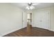 Bright bedroom with hardwood floors, closet and an open doorway view to a staircase at 104 Low Country Ct, Morrisville, NC 27560