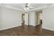Well-lit bedroom showcasing hardwood floors and staircase view at 104 Low Country Ct, Morrisville, NC 27560