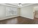 Bright bedroom with hardwood floors and windows offering natural light at 104 Low Country Ct, Morrisville, NC 27560