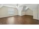 Large, spacious bonus room with hardwood floors, modern ceiling fan, and ample natural light at 104 Low Country Ct, Morrisville, NC 27560