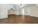 Spacious bonus room featuring hardwood floors, neutral walls, and a modern ceiling fan at 104 Low Country Ct, Morrisville, NC 27560
