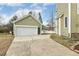 Detached two-car garage with a driveway and a well-kept lawn at 104 Low Country Ct, Morrisville, NC 27560