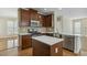 Modern kitchen with an island, stainless steel appliances, and beautiful countertops at 104 Low Country Ct, Morrisville, NC 27560