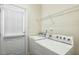 Functional laundry room featuring a washer, dryer, and plenty of storage space at 104 Low Country Ct, Morrisville, NC 27560