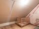Unfinished attic features wooden crib at 107 Bella Casa Way, Clayton, NC 27527