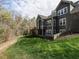 Well-maintained backyard, with lush lawn, trees, and the home's exterior, perfect for outdoor enjoyment at 107 Bella Casa Way, Clayton, NC 27527