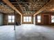 Unfinished basement showcasing ample space, natural light, and potential for customization at 107 Bella Casa Way, Clayton, NC 27527