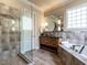This bathroom has a vanity, soaking tub, and a glass shower at 107 Bella Casa Way, Clayton, NC 27527