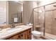 Updated bathroom with granite countertop vanity, enclosed shower, and tile floors at 107 Bella Casa Way, Clayton, NC 27527